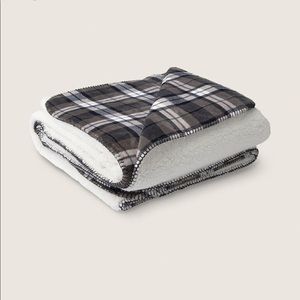 New VS pink dark charcoal plaid Sherpa blanket.